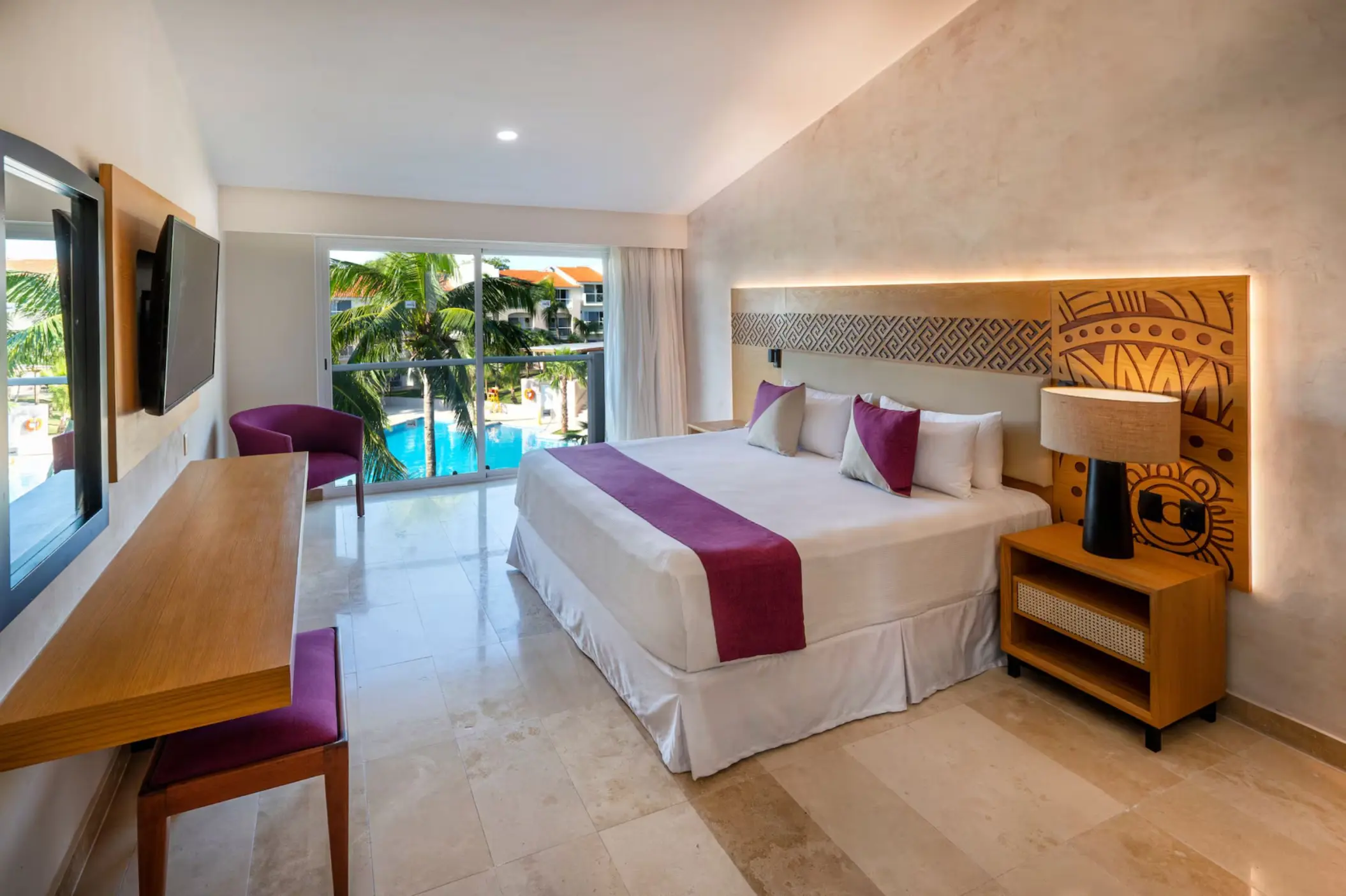 room with king bed and pool view at Viva Azteca by Wyndham