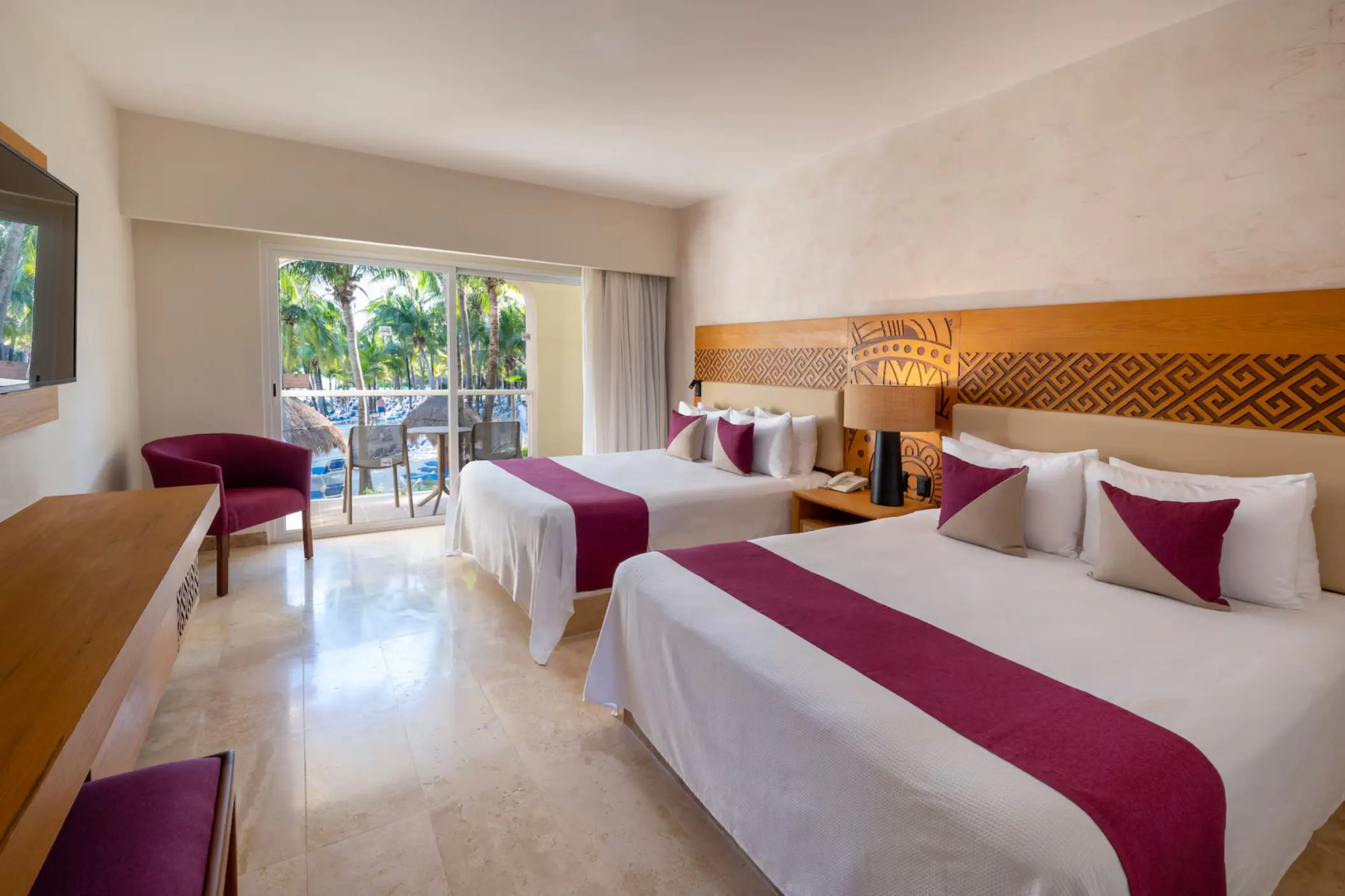 room with two queen beds and pool view at Viva Azteca by Wyndham