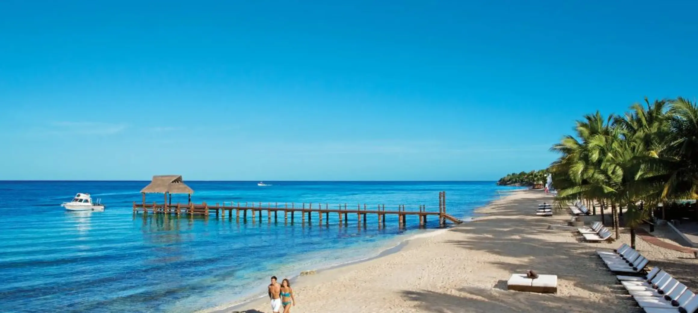 couple on the beach at Secrets Aura Cozumel