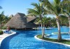 Barcelo Maya Beach pool and palapa